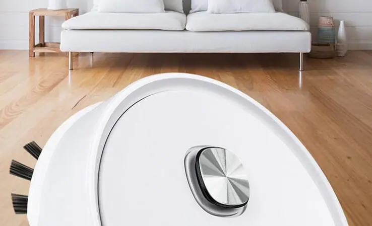 RoboVac Pro cleaning a hardwood floor